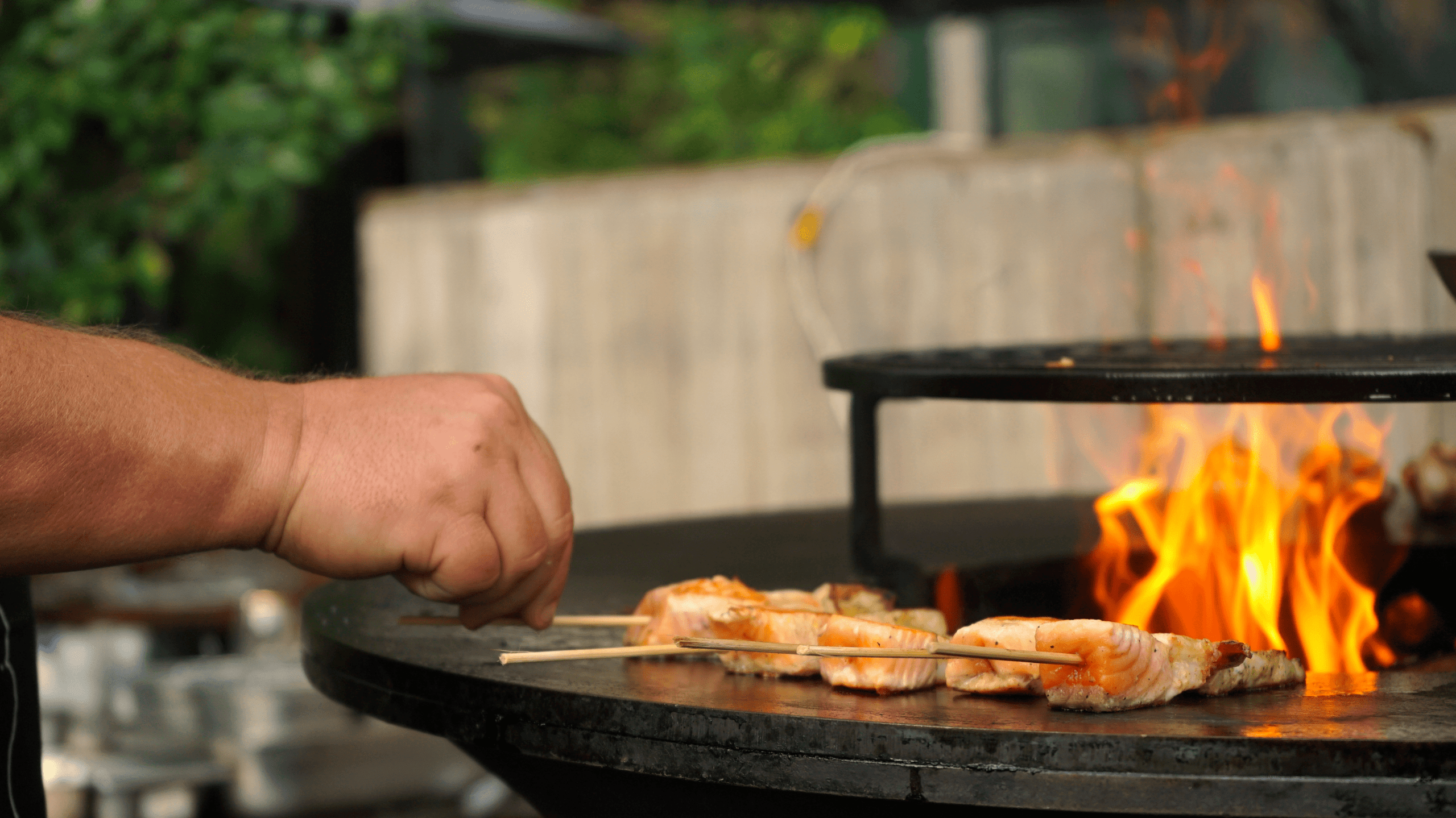 Grilling salmon on a barbecue at SERRa 