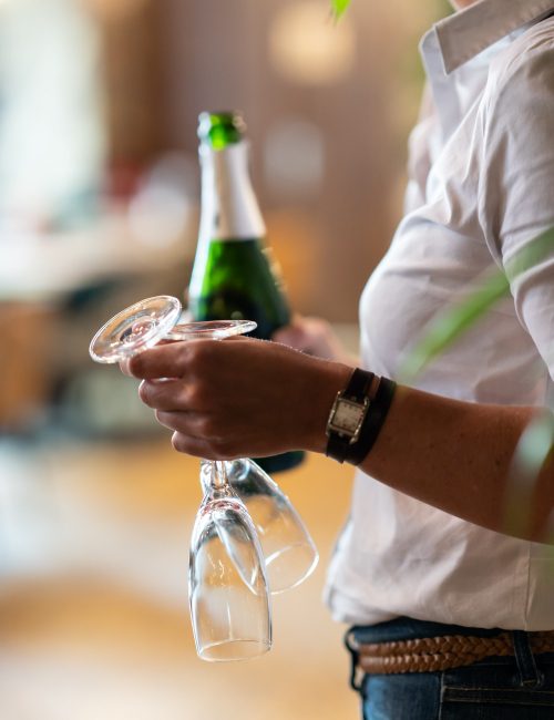 glasses and bottle of champagne at indoor garden brunch brussels